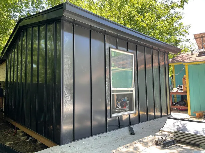 Black standing seam metal wall panels for Roof Inspection in University Park